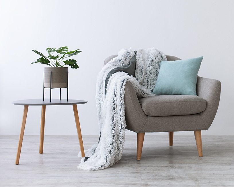 Chair next to a plant for individual therapist in Rochester, NY
