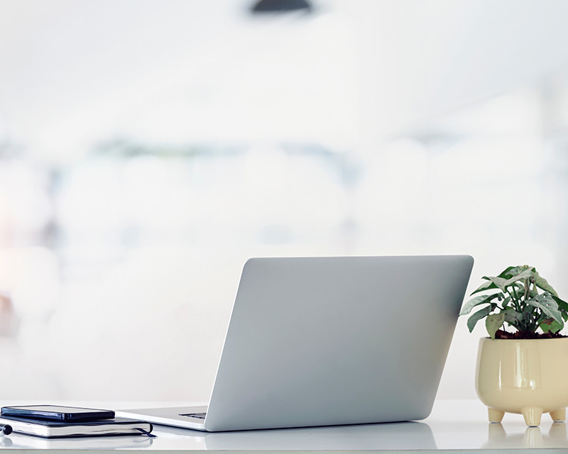 Laptop on a table for reduced rate therapy program